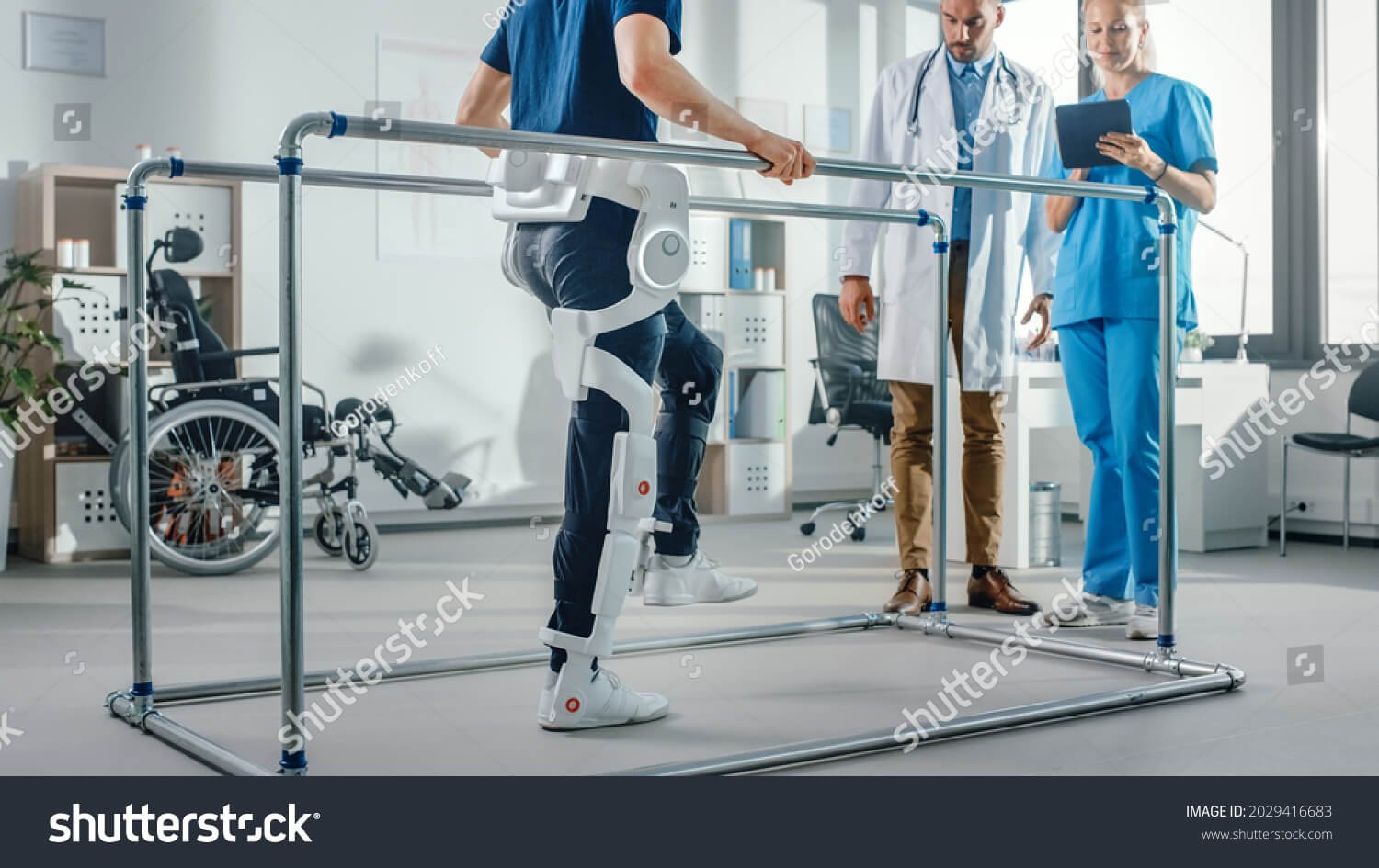 stock-photo-modern-hospital-physical-therapy-patient-with-injury-walks-wearing-advanced-robotic-exoskeleton-2029416683 (1)